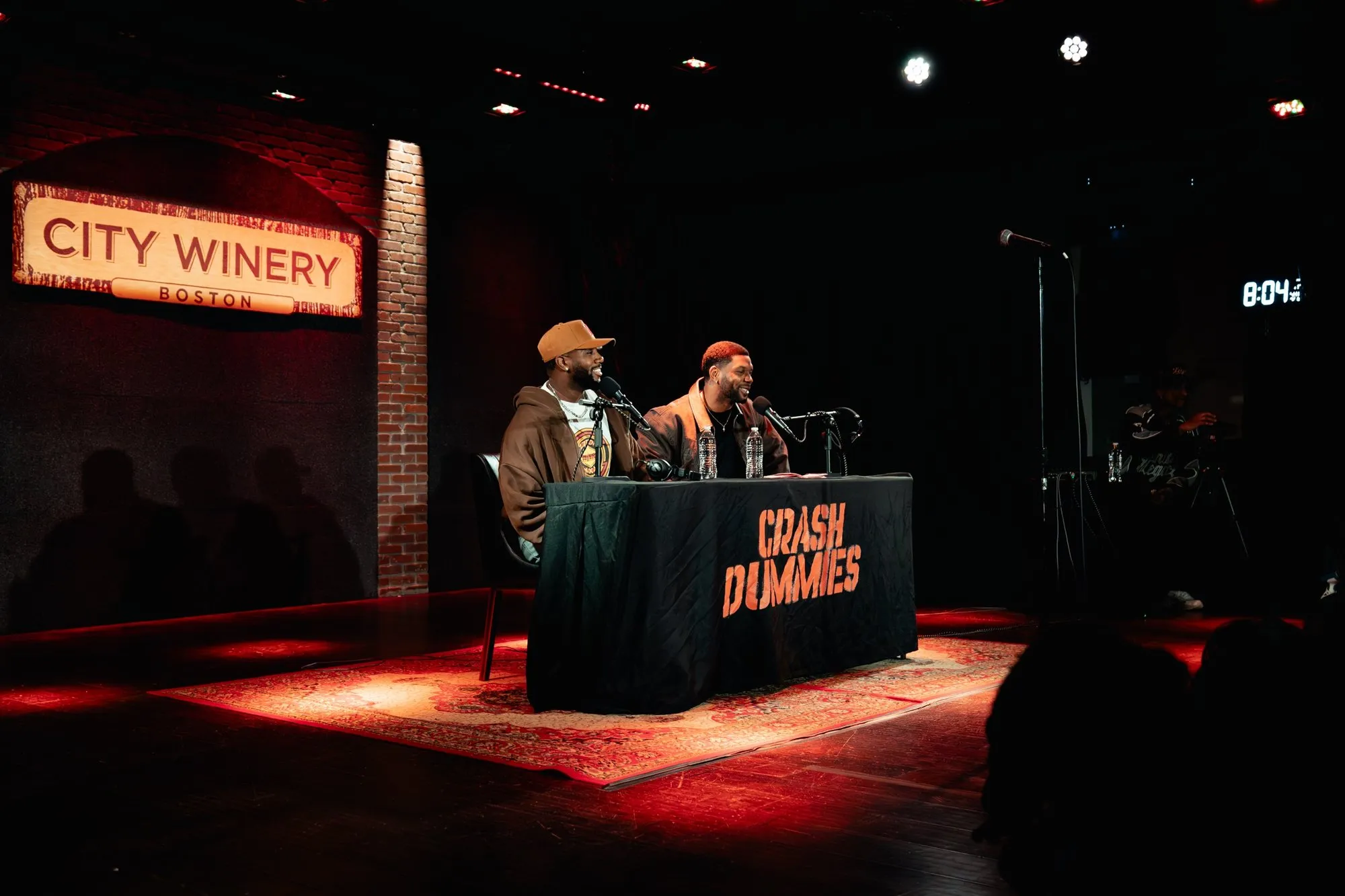 Mike and Pat at the Crash Dummies desk under the City Winery sign