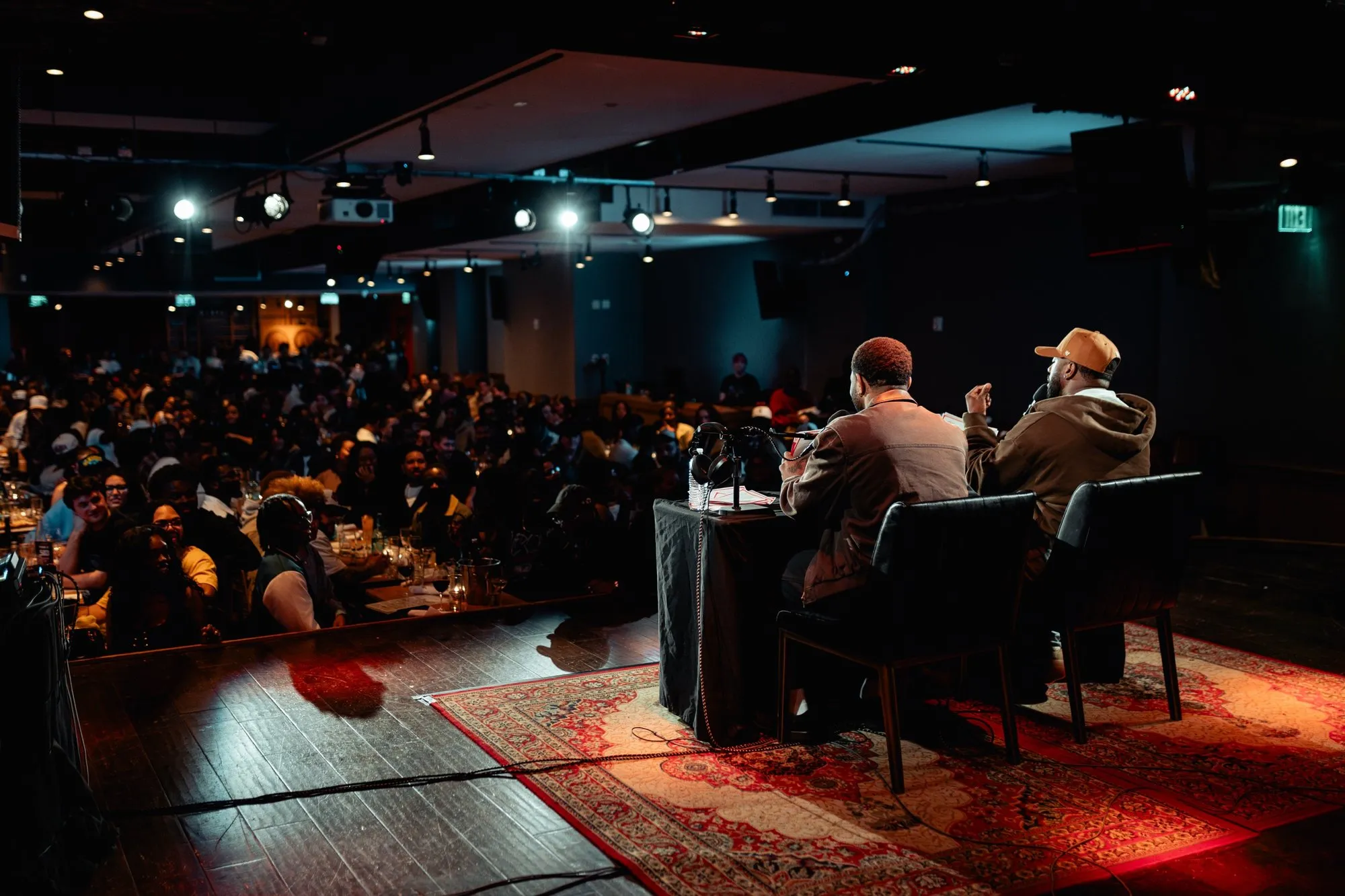 Mike and Pat at the Crash Dummies desk with the City Winery Boston crowd looking on