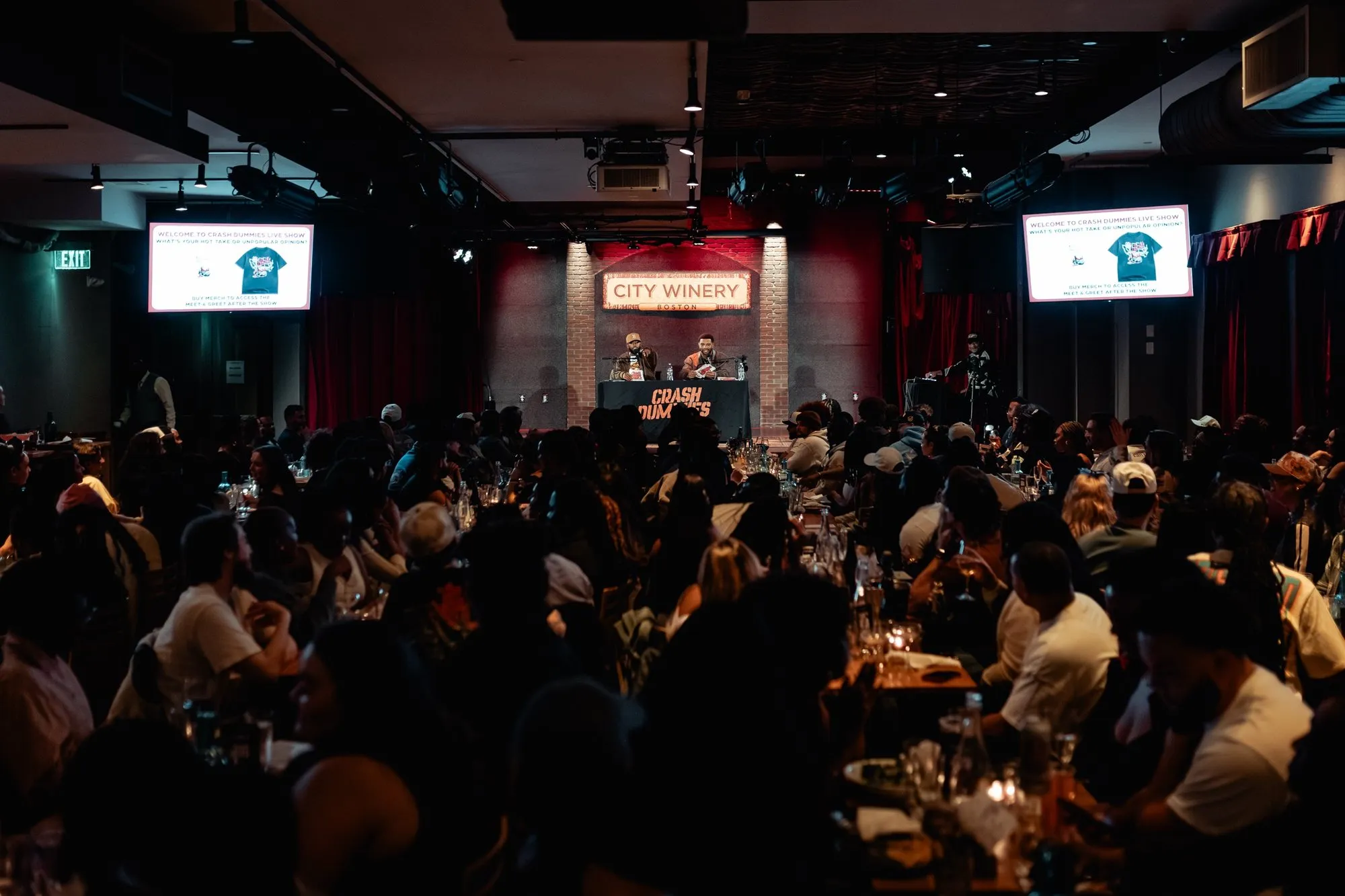 Wide shot of the packed room from the back