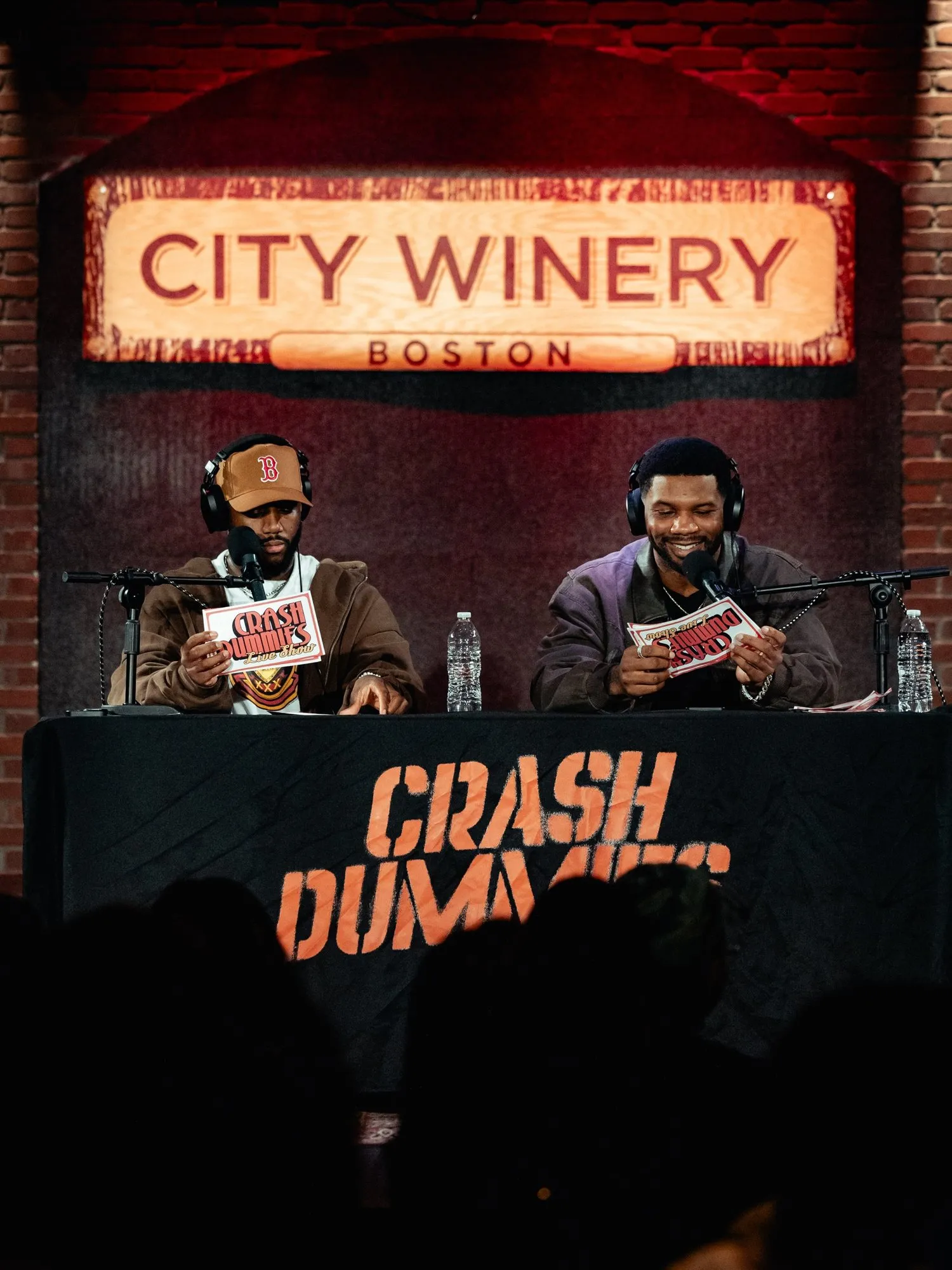Mike and Pat at the desk under the City Winery Boston sign