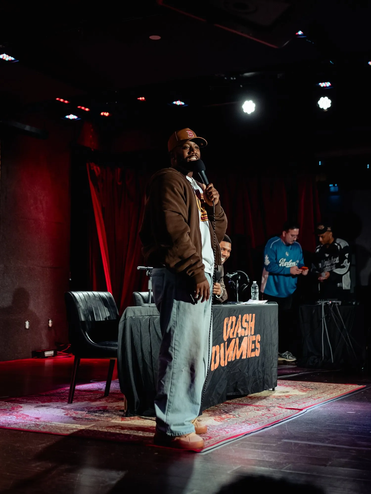 A host standing at center stage