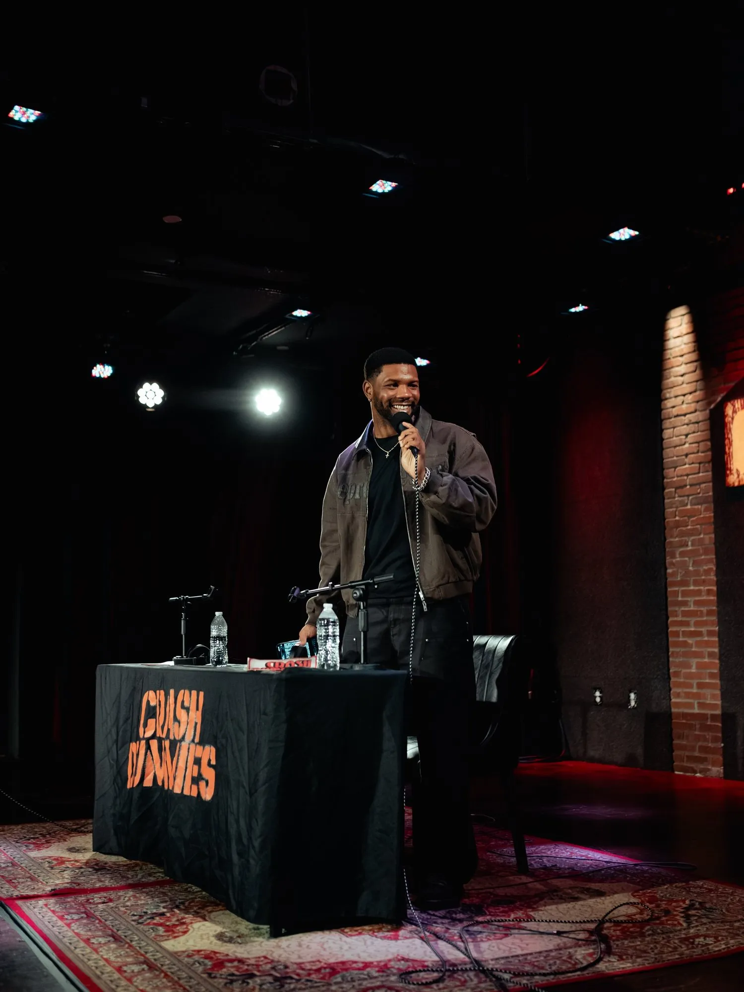 A host working the stage with the mic