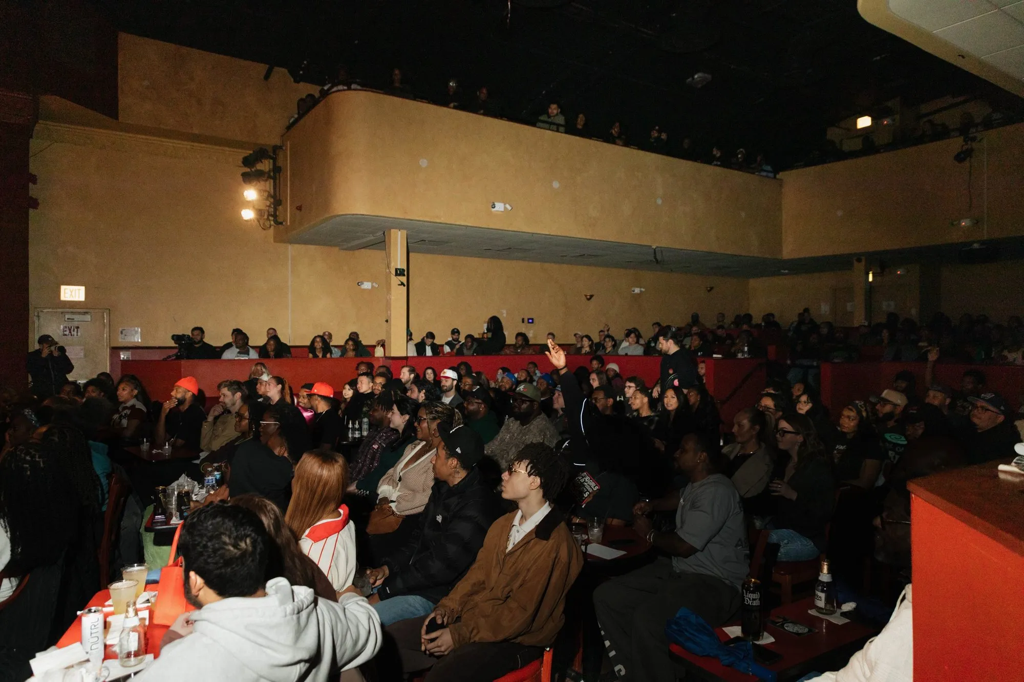 The packed room from the balcony