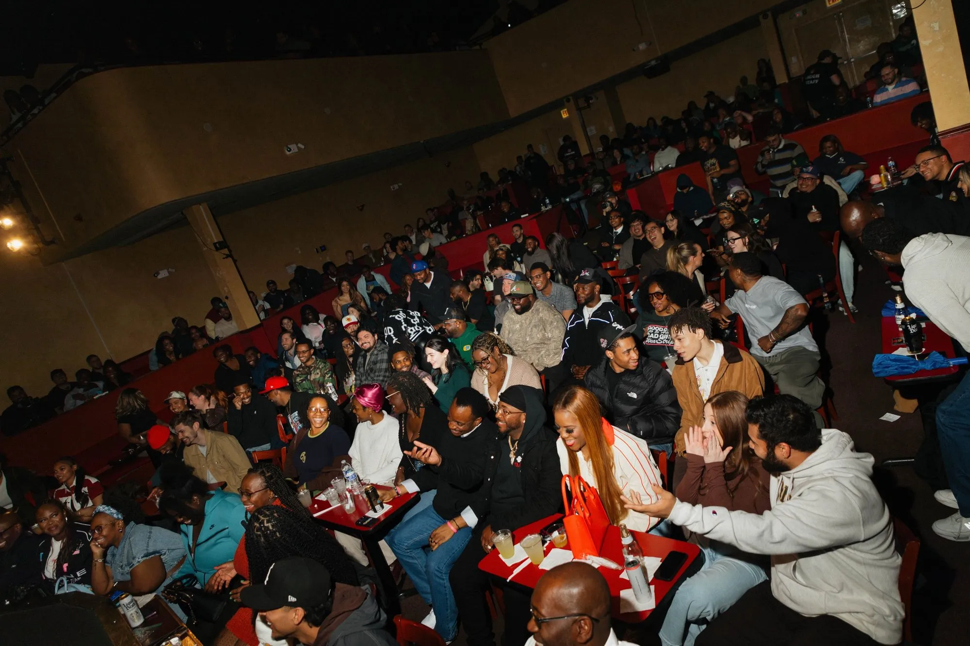The crowd filling the theater seats