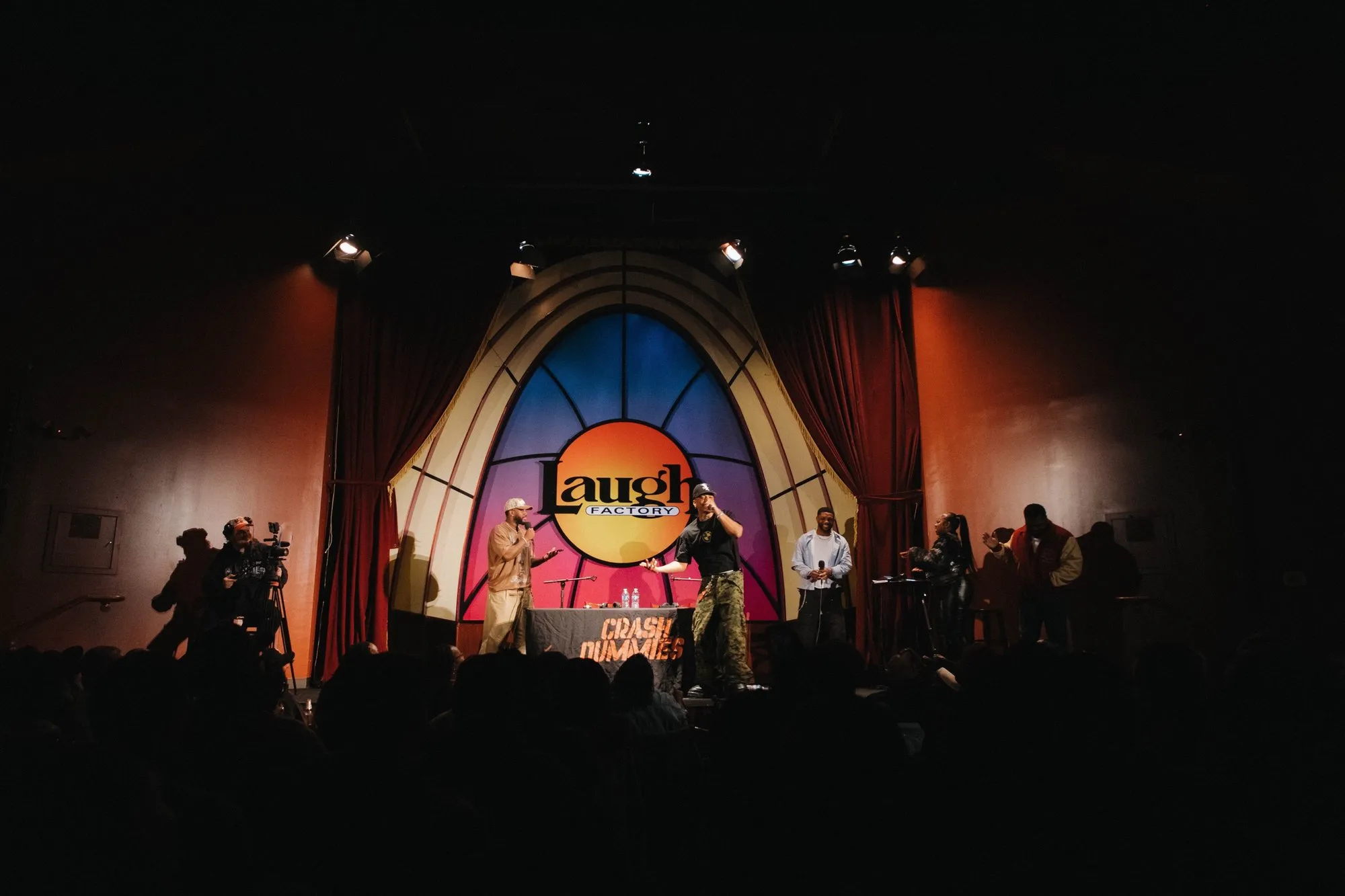 The stage glowing under the Laugh Factory sign