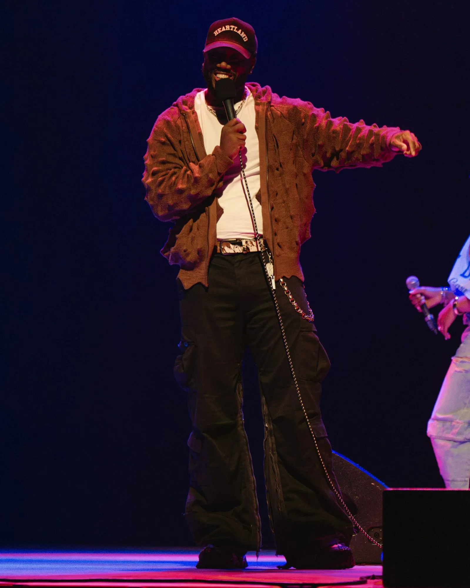 A host working the stage with the mic