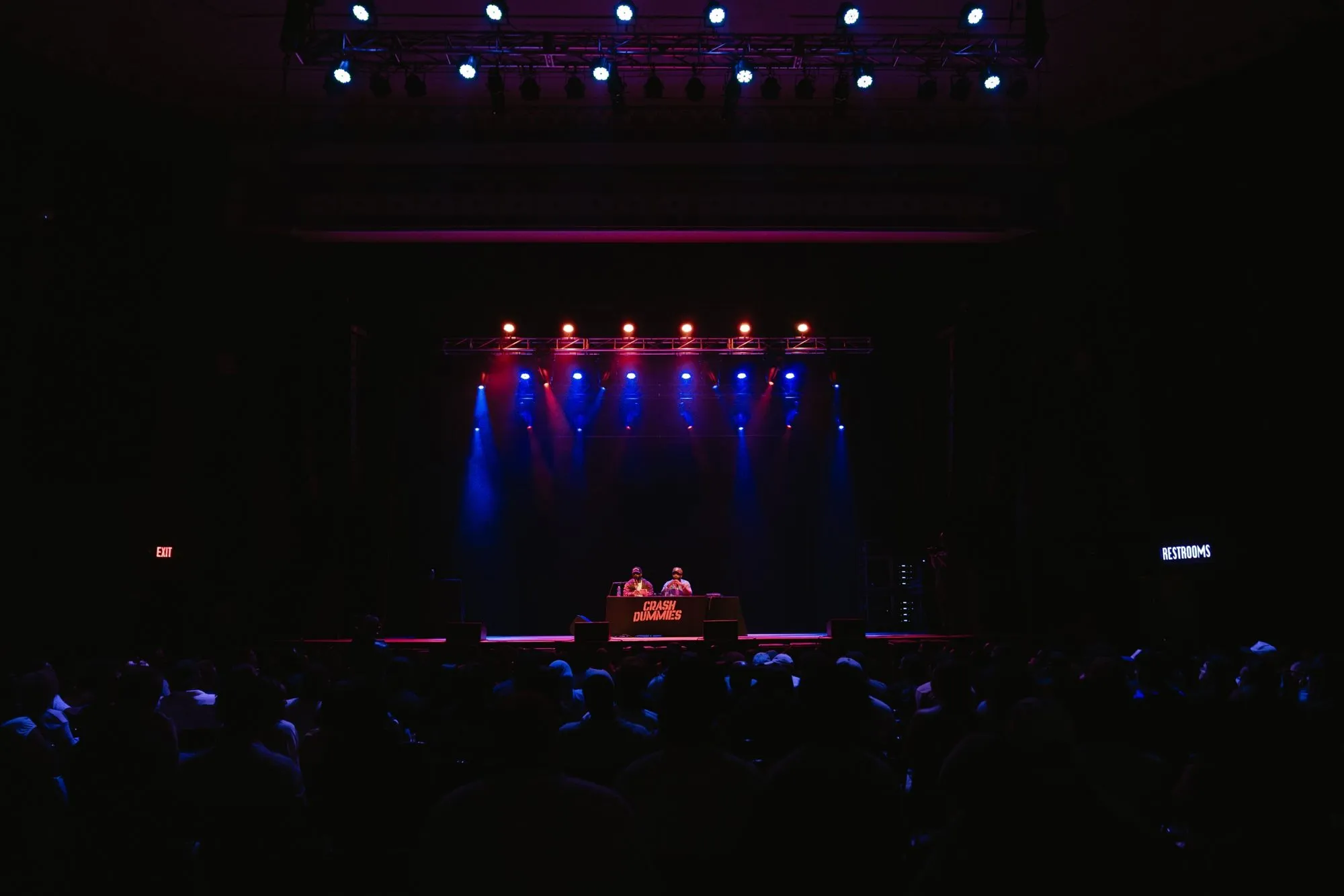 Head-on view of the stage from the back of the room
