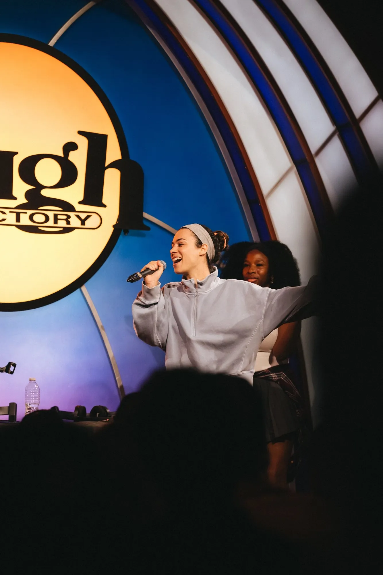 A fan takes the mic at center stage