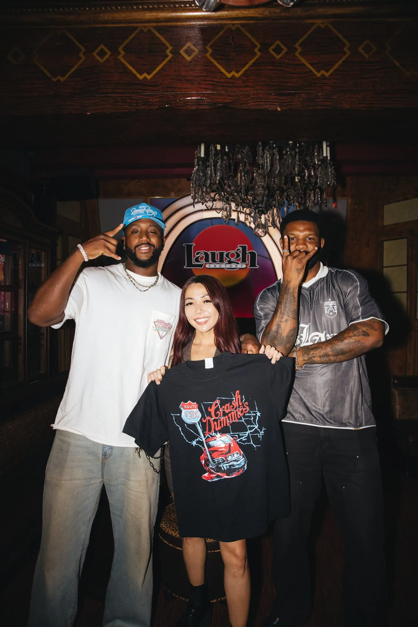 Fans hold up a Route CDP shirt with the hosts